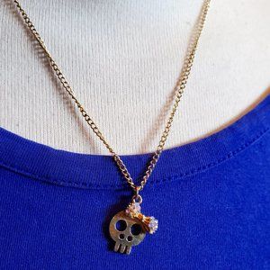 18" Gold Tone Skull with Pink Bow Pendant Necklace